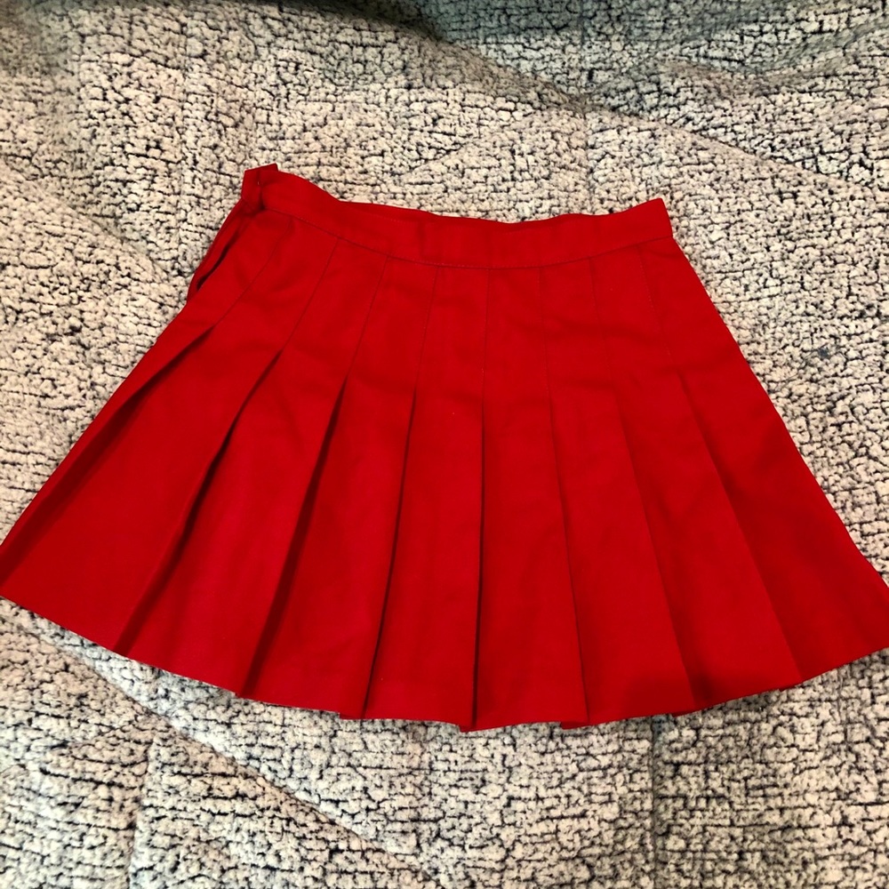 red pleated skirt